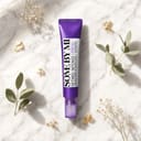 Some By Mi Retinol Intense Eye Cream on surface with botanical elements
