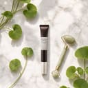 Skin1004 Probio-Cica Bakuchiol Eye Cream on surface with botanical elements